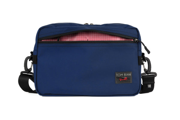 The Side Hustle in Deep Blue Ballistic with Sakura 200 Halcyon interior.